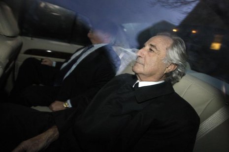 Bernard Madoff (R), who confessed to defrauding investors of 50 billion dollars, arrives home after a hearing at Federal Court, in New York, Bernard Madoff (R), who confessed to defrauding investors of 50 billion dollars, arrives home after a hearing at Federal Court, in New York,