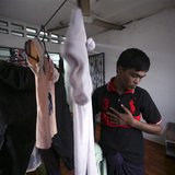 Bozor Mohammed from the Rakhine state in Myanmar puts his clothes, which were hung out to dry, inside his house after an interview with Reut Bozor Mohammed from the Rakhine state in Myanmar puts his clothes, which were hung out to dry, inside his house after an interview with Reut