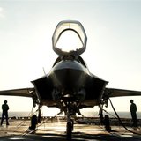 The flight deck crew secures an F-35B Lighting II aircraft aboard the amphibious assault ship USS Wasp following testing in this handout pho The flight deck crew secures an F-35B Lighting II aircraft aboard the amphibious assault ship USS Wasp following testing in this handout pho