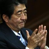 Japan's Prime Minister Shinzo Abe claps his hands during the Lower House plenary session of the parliament in Tokyo November 26, 2013. REUTE Japan's Prime Minister Shinzo Abe claps his hands during the Lower House plenary session of the parliament in Tokyo November 26, 2013. REUTE