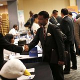 A job seeker (R) meets with a prospective employer at a career fair in New York City, October 24, 2012. REUTERS/Mike Segar A job seeker (R) meets with a prospective employer at a career fair in New York City, October 24, 2012. REUTERS/Mike Segar