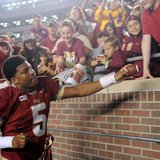 Florida State Seminoles quarterback Jameis Winston (5) signs autographs for fans after the game against the Idaho Vandals at Doak Campbell S Florida State Seminoles quarterback Jameis Winston (5) signs autographs for fans after the game against the Idaho Vandals at Doak Campbell S