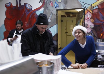 Small-business owners Ralph Gorham (C) and Susan Povich (R) prepare for a delivery of live lobsters at their shop "Redhook Lobster Pound" in Small-business owners Ralph Gorham (C) and Susan Povich (R) prepare for a delivery of live lobsters at their shop "Redhook Lobster Pound" in