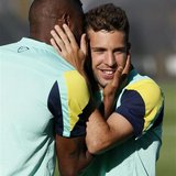 Barcelona's Alex Song (L) hugs his teammate Jordi Alba during a training session at the Ciutat Esportiva Joan Gamper in Sant Joan Despi near Barcelona's Alex Song (L) hugs his teammate Jordi Alba during a training session at the Ciutat Esportiva Joan Gamper in Sant Joan Despi near