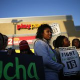 Protesters gather outside McDonald's in Los Angeles, California, December 5, 2013. REUTERS/Lucy Nicholson Protesters gather outside McDonald's in Los Angeles, California, December 5, 2013. REUTERS/Lucy Nicholson