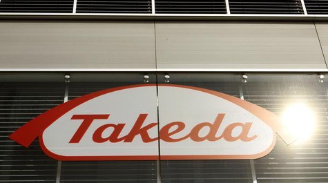 The logo of Japanese Takeda Pharmaceutical Co is seen at an office building in Glattbrugg near Zurich March 7, 2012. REUTERS/Arnd Wiegmann The logo of Japanese Takeda Pharmaceutical Co is seen at an office building in Glattbrugg near Zurich March 7, 2012. REUTERS/Arnd Wiegmann