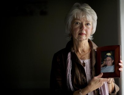 Terri Roberts, the mother of Amish school shooter Charles Roberts, holds a photograph of her son at New Covenant Community Church in Delta, Terri Roberts, the mother of Amish school shooter Charles Roberts, holds a photograph of her son at New Covenant Community Church in Delta,
