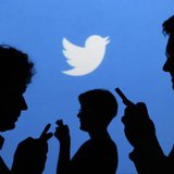 People holding mobile phones are silhouetted against a backdrop projected with the Twitter logo in this illustration picture taken in Warsaw People holding mobile phones are silhouetted against a backdrop projected with the Twitter logo in this illustration picture taken in Warsaw