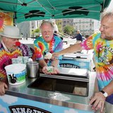 As iconic 1960's activist Wavy Gravy (L) looks on, Ben & Jerry's Ice Cream co-founders Ben Cohen (C) and Jerry Greenfield serve the first sc As iconic 1960's activist Wavy Gravy (L) looks on, Ben & Jerry's Ice Cream co-founders Ben Cohen (C) and Jerry Greenfield serve the first sc