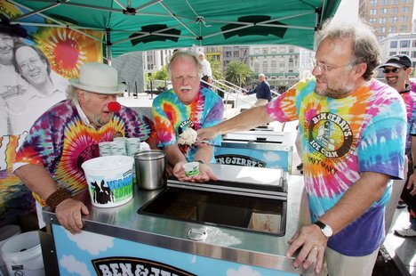 As iconic 1960's activist Wavy Gravy (L) looks on, Ben & Jerry's Ice Cream co-founders Ben Cohen (C) and Jerry Greenfield serve the first sc As iconic 1960's activist Wavy Gravy (L) looks on, Ben & Jerry's Ice Cream co-founders Ben Cohen (C) and Jerry Greenfield serve the first sc