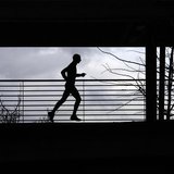 A man runs at the Athletic stadium in Florence February 16, 2011. REUTERS/Alessandro Bianchi A man runs at the Athletic stadium in Florence February 16, 2011. REUTERS/Alessandro Bianchi
