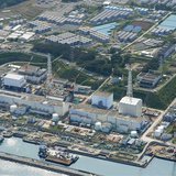 An aerial view shows the Tokyo Electric Power Co.'s (TEPCO) tsunami-crippled Fukushima Daiichi nuclear power plant and its contaminated wate An aerial view shows the Tokyo Electric Power Co.'s (TEPCO) tsunami-crippled Fukushima Daiichi nuclear power plant and its contaminated wate