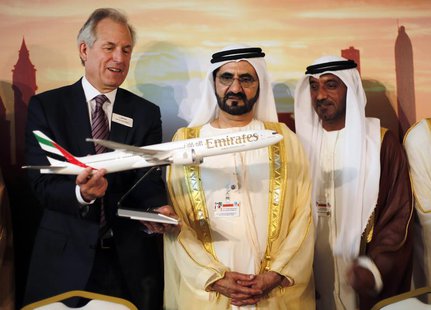 Boeing Chairman James McNerney (L) shows United Arab Emirates' Prime Minister and Ruler of Dubai Sheikh Mohammed bin Rashid al-Maktoum (2nd Boeing Chairman James McNerney (L) shows United Arab Emirates' Prime Minister and Ruler of Dubai Sheikh Mohammed bin Rashid al-Maktoum (2nd