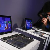 Members of the media take pictures of Surface 2 tablets during the launch of the Microsoft Surface 2 tablets in New York September 23, 2013. Members of the media take pictures of Surface 2 tablets during the launch of the Microsoft Surface 2 tablets in New York September 23, 2013.