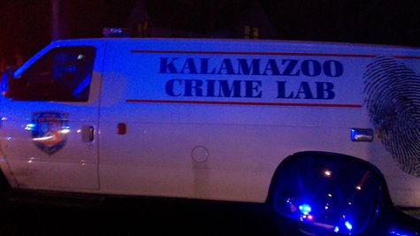 Crime Lab van called in to investigate, parked in the reflected glow of police lights. Crime Lab van called in to investigate, parked in the reflected glow of police lights.