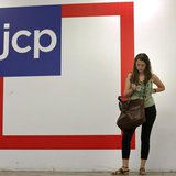 A woman checks her phone outside the entrance of a J.C. Penney store in New York August 14, 2013. REUTERS/Brendan McDermid A woman checks her phone outside the entrance of a J.C. Penney store in New York August 14, 2013. REUTERS/Brendan McDermid