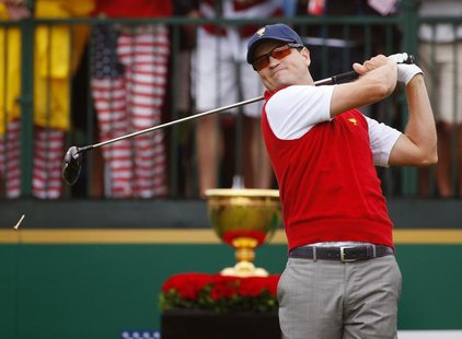 U.S. golfer Zach Johnson tees off during the Singles matches for the 2013 Presidents Cup golf tournament at Muirfield Village Golf Club in D U.S. golfer Zach Johnson tees off during the Singles matches for the 2013 Presidents Cup golf tournament at Muirfield Village Golf Club in D