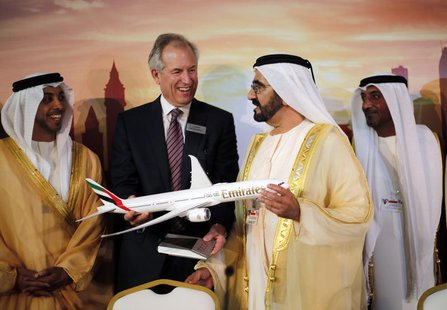 Boeing Chairman James McNerney (2nd L) shows United Arab Emirates' Prime Minister and Ruler of Dubai Sheikh Mohammed bin Rashid al-Maktoum ( Boeing Chairman James McNerney (2nd L) shows United Arab Emirates' Prime Minister and Ruler of Dubai Sheikh Mohammed bin Rashid al-Maktoum (