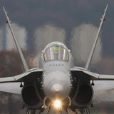 A Swiss Boeing F/A-18C rolls along the taxiway at the Swiss Army Airbase in Emmen, central Switzerland November 14, 2008. REUTERS/Michael Bu A Swiss Boeing F/A-18C rolls along the taxiway at the Swiss Army Airbase in Emmen, central Switzerland November 14, 2008. REUTERS/Michael Bu