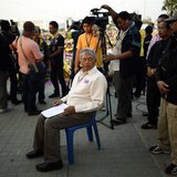 Protest leader Suthep Thaugsuban prepares to address anti-government protesters as they take part in birthday celebrations for Thailand's re Protest leader Suthep Thaugsuban prepares to address anti-government protesters as they take part in birthday celebrations for Thailand's re