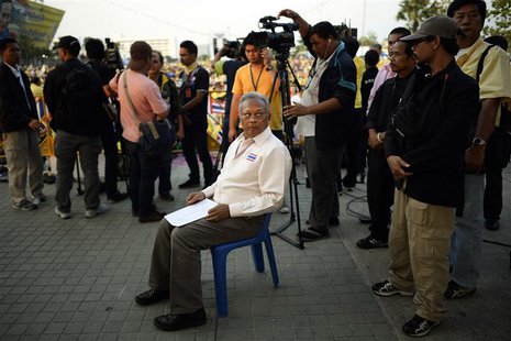 Protest leader Suthep Thaugsuban prepares to address anti-government protesters as they take part in birthday celebrations for Thailand's re Protest leader Suthep Thaugsuban prepares to address anti-government protesters as they take part in birthday celebrations for Thailand's re