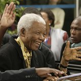 Former South African President Nelson Mandela waves as he leaves after casting his vote at a polling station in Houghton, Johannesburg, in t Former South African President Nelson Mandela waves as he leaves after casting his vote at a polling station in Houghton, Johannesburg, in t