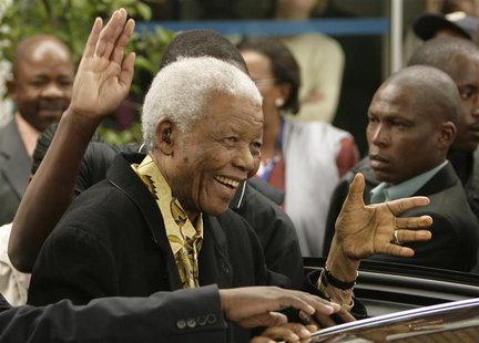Former South African President Nelson Mandela waves as he leaves after casting his vote at a polling station in Houghton, Johannesburg, in t Former South African President Nelson Mandela waves as he leaves after casting his vote at a polling station in Houghton, Johannesburg, in t