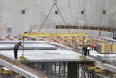 Workers are seen at a construction site of a building which will house apartments and offices in central Brussels November 26, 2013. REUTERS Workers are seen at a construction site of a building which will house apartments and offices in central Brussels November 26, 2013. REUTERS