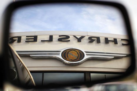The Chrysler logo is reflected in the rear view mirror of a vehicle on the lot at Clark Chrysler Jeep Dodge dealership in Methuen, Massachus The Chrysler logo is reflected in the rear view mirror of a vehicle on the lot at Clark Chrysler Jeep Dodge dealership in Methuen, Massachus