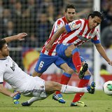 Real Madrid's Xabi Alonso (L) challenges Atletico Madrid's Radamel Falcao during their Spanish King's Cup final soccer match at Santiago Ber Real Madrid's Xabi Alonso (L) challenges Atletico Madrid's Radamel Falcao during their Spanish King's Cup final soccer match at Santiago Ber