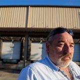 Richard Smith stands in front of a factory owned by Platinum that he worked at for 20 years before it was closed in 2010 by the company in T Richard Smith stands in front of a factory owned by Platinum that he worked at for 20 years before it was closed in 2010 by the company in T