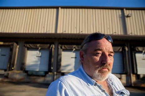 Richard Smith stands in front of a factory owned by Platinum that he worked at for 20 years before it was closed in 2010 by the company in T Richard Smith stands in front of a factory owned by Platinum that he worked at for 20 years before it was closed in 2010 by the company in T
