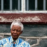 Nelson Mandela sits beneath the window of his prison cell on Robben Island near Cape Town, November 28, 2003. REUTERS/Mike Hutchings Nelson Mandela sits beneath the window of his prison cell on Robben Island near Cape Town, November 28, 2003. REUTERS/Mike Hutchings