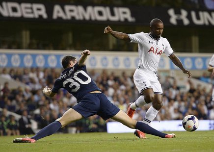 Tottenham Hotspur's Jermain Defoe (R) goes past Dinamo Tbilisi's Giorgi Gvelesiani during their Europa League soccer match at White Hart Lan Tottenham Hotspur's Jermain Defoe (R) goes past Dinamo Tbilisi's Giorgi Gvelesiani during their Europa League soccer match at White Hart Lan