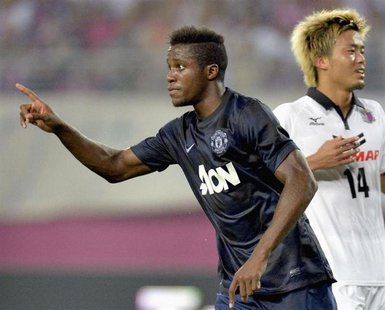 Manchester United's Wilfried Zaha (L) celebrates after scoring during their friendly soccer match against Cerezo Osaka in Osaka, western Jap Manchester United's Wilfried Zaha (L) celebrates after scoring during their friendly soccer match against Cerezo Osaka in Osaka, western Jap