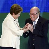 Brazilian President Dilma Rousseff (L) and FIFA President Sepp Blatter react on stage during the draw for the 2014 World Cup at the Costa do Brazilian President Dilma Rousseff (L) and FIFA President Sepp Blatter react on stage during the draw for the 2014 World Cup at the Costa do