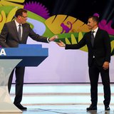 Former Italy soccer player Fabio Cannavaro (R) hands a ball that he had drawn from a pot to FIFA Secretary General Jerome Valcke during the Former Italy soccer player Fabio Cannavaro (R) hands a ball that he had drawn from a pot to FIFA Secretary General Jerome Valcke during the