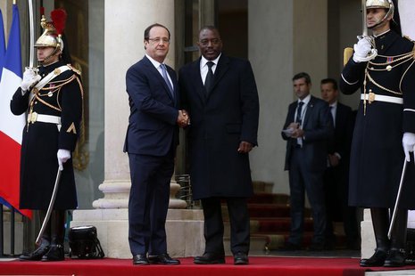 France's President Francois Hollande (L) greets Democratic Republic of Congo's President Joseph Kabila in the courtyard of the Elysee Palace France's President Francois Hollande (L) greets Democratic Republic of Congo's President Joseph Kabila in the courtyard of the Elysee Palace