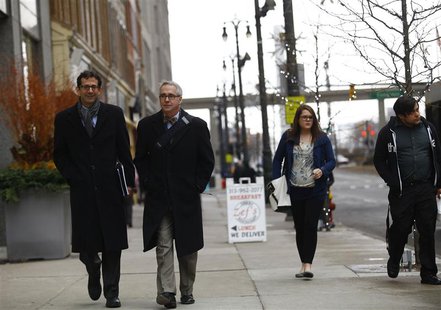 Pedestrians walk along Woodward Avenue in Detroit, Michigan December 3, 2013. REUTERS/Joshua Lott Pedestrians walk along Woodward Avenue in Detroit, Michigan December 3, 2013. REUTERS/Joshua Lott