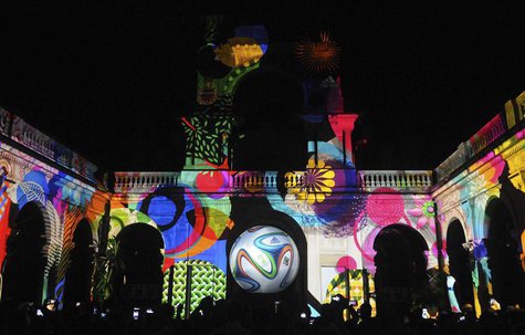 People take pictures of the official match ball for the 2014 World Cup named "brazuca" which is projected on a building at Lage Park during People take pictures of the official match ball for the 2014 World Cup named "brazuca" which is projected on a building at Lage Park during