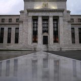 The facade of the U.S. Federal Reserve building is reflected on wet marble during the early morning hours in Washington, July 31, 2013. REUT The facade of the U.S. Federal Reserve building is reflected on wet marble during the early morning hours in Washington, July 31, 2013. REUT