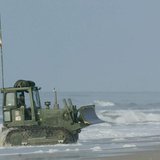 A bulldozer makes its way onto Onslow beach at Camp Lejeune, North Carolina, May 26, 2003 after being unloaded from a landing craft. REUTERS A bulldozer makes its way onto Onslow beach at Camp Lejeune, North Carolina, May 26, 2003 after being unloaded from a landing craft. REUTERS