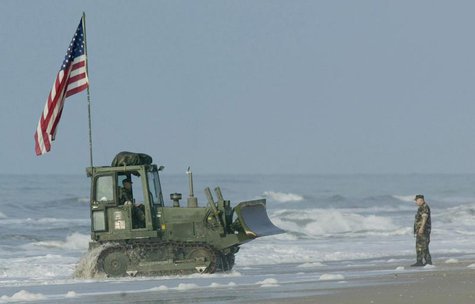 A bulldozer makes its way onto Onslow beach at Camp Lejeune, North Carolina, May 26, 2003 after being unloaded from a landing craft. REUTERS A bulldozer makes its way onto Onslow beach at Camp Lejeune, North Carolina, May 26, 2003 after being unloaded from a landing craft. REUTERS