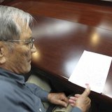 U.S. citizen Merrill E. Newman puts his thumbprint on a piece of paper, after being taken into custody by North Korea, at an undisclosed loc U.S. citizen Merrill E. Newman puts his thumbprint on a piece of paper, after being taken into custody by North Korea, at an undisclosed loc