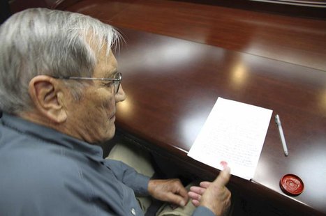 U.S. citizen Merrill E. Newman puts his thumbprint on a piece of paper, after being taken into custody by North Korea, at an undisclosed loc U.S. citizen Merrill E. Newman puts his thumbprint on a piece of paper, after being taken into custody by North Korea, at an undisclosed loc