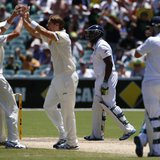 England's Michael Carberry (2nd R) walks off the field after his dismissal, as Australia's Shane Watson (2nd L) and Ryan Harris (L) celebrat England's Michael Carberry (2nd R) walks off the field after his dismissal, as Australia's Shane Watson (2nd L) and Ryan Harris (L) celebrat