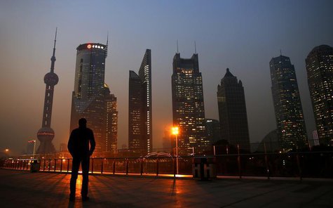 A man looks at the Pudong financial district of Shanghai November 20, 2013. REUTERS/Carlos Barria A man looks at the Pudong financial district of Shanghai November 20, 2013. REUTERS/Carlos Barria