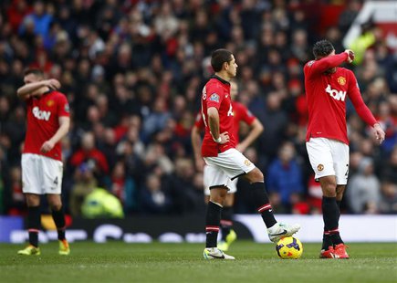 (L to R) Manchester United's Phil Jones, Javier Hernandez and Robin van Persie react during their English Premier League soccer match agains (L to R) Manchester United's Phil Jones, Javier Hernandez and Robin van Persie react during their English Premier League soccer match agains