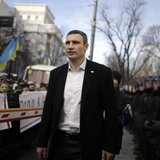 Vitali Klitschko, heavyweight boxing champion and UDAR (Ukrainian Democratic Alliance for Reform) party leader, walks past supporters and po Vitali Klitschko, heavyweight boxing champion and UDAR (Ukrainian Democratic Alliance for Reform) party leader, walks past supporters and po