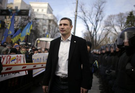 Vitali Klitschko, heavyweight boxing champion and UDAR (Ukrainian Democratic Alliance for Reform) party leader, walks past supporters and po Vitali Klitschko, heavyweight boxing champion and UDAR (Ukrainian Democratic Alliance for Reform) party leader, walks past supporters and po